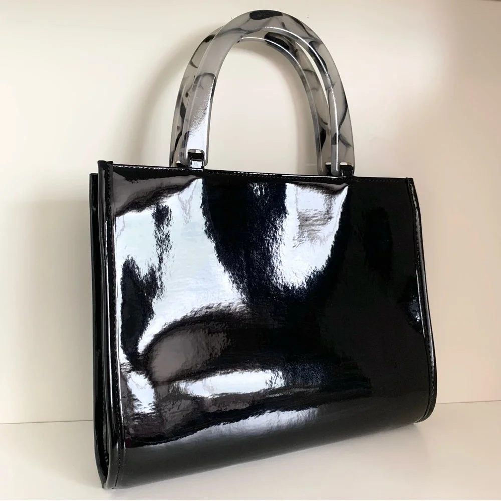 Hold NWOT Neiman Marcus black patent marble handle modern bag